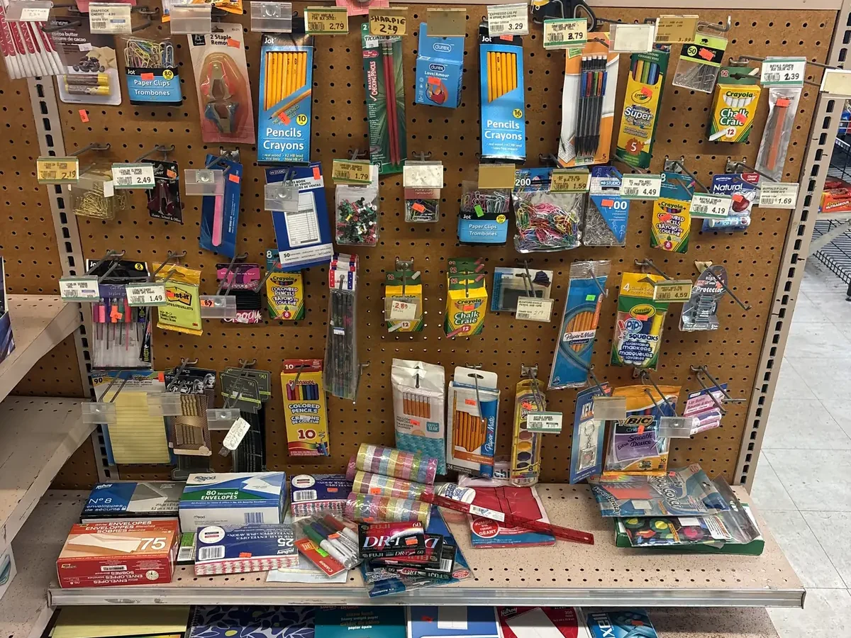 Stationery and school supplies on a pegboard